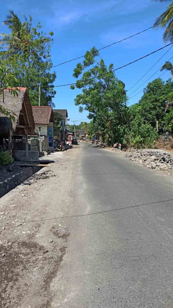 Street in Amed with shops under construction